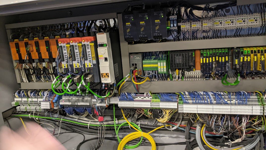 Conveyor control panel with drives, relays, and terminal wiring